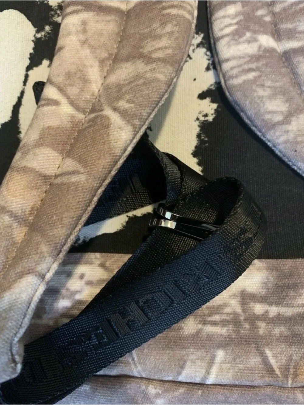 'The Mystery of Tap Water' Beige Camouflage Backpack